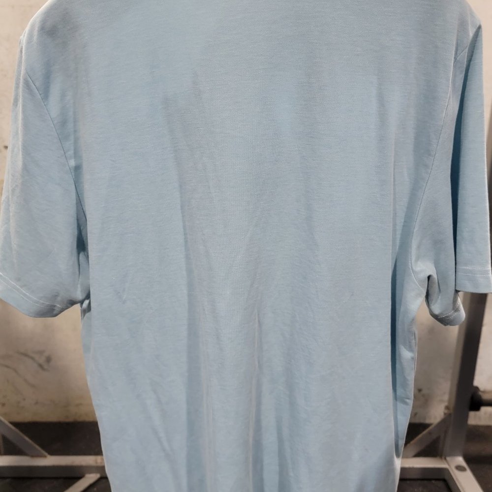 TravisMathews light blue polo short sleeve